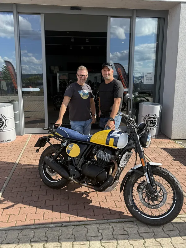 GARAGE customer at the handover of a new Royal Enfield motorcycle