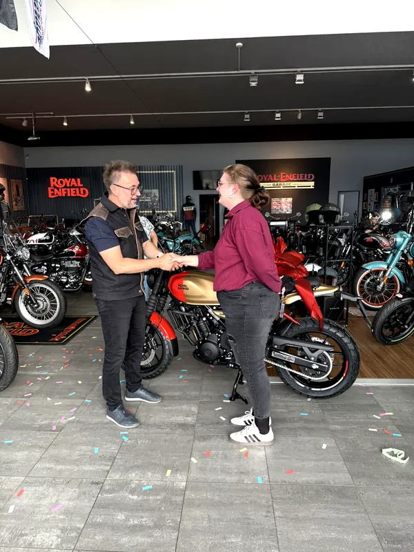 GARAGE customer at the handover of a new Royal Enfield motorcycle