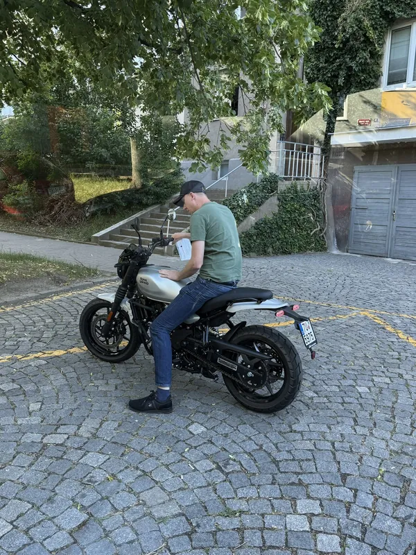 GARAGE customer at the handover of a new Royal Enfield motorcycle
