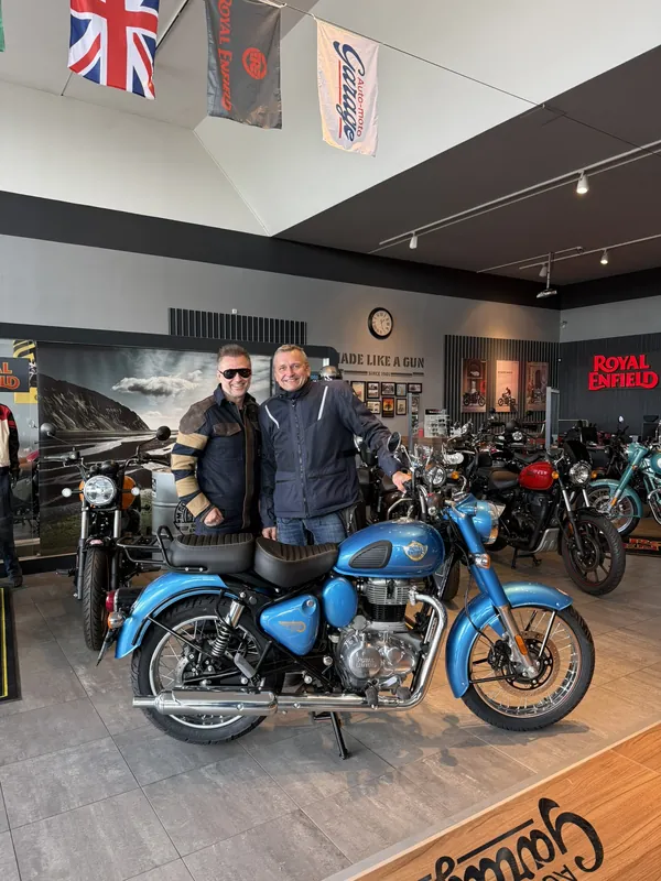 GARAGE customer at the handover of a new Royal Enfield motorcycle