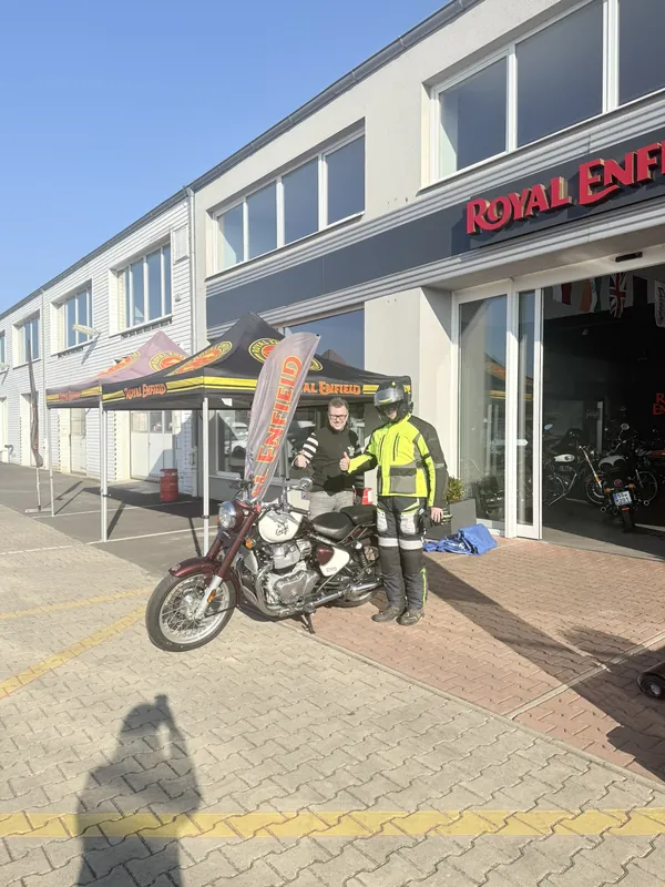 GARAGE customer at the handover of a new Royal Enfield motorcycle