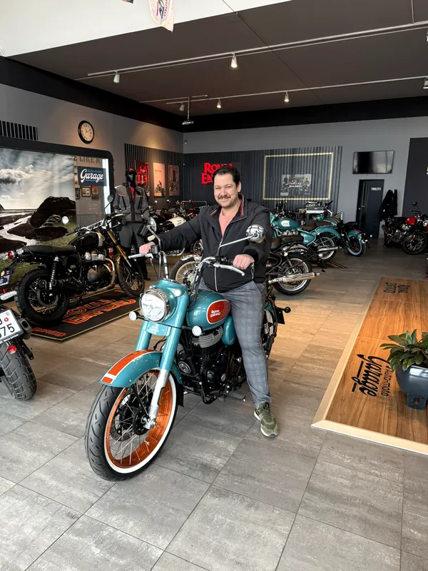 GARAGE customer at the handover of a new Royal Enfield motorcycle