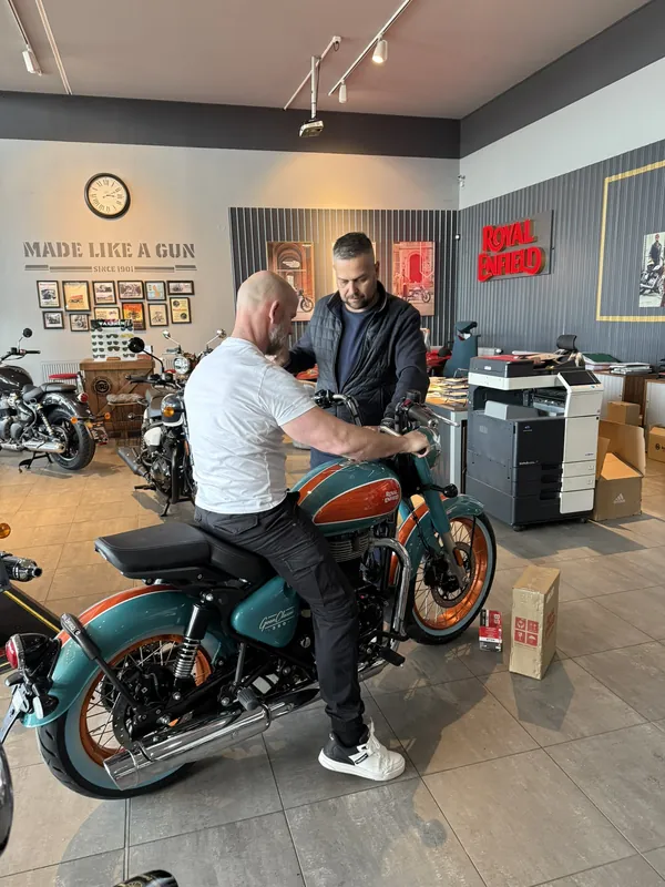 GARAGE customer at the handover of a new Royal Enfield motorcycle