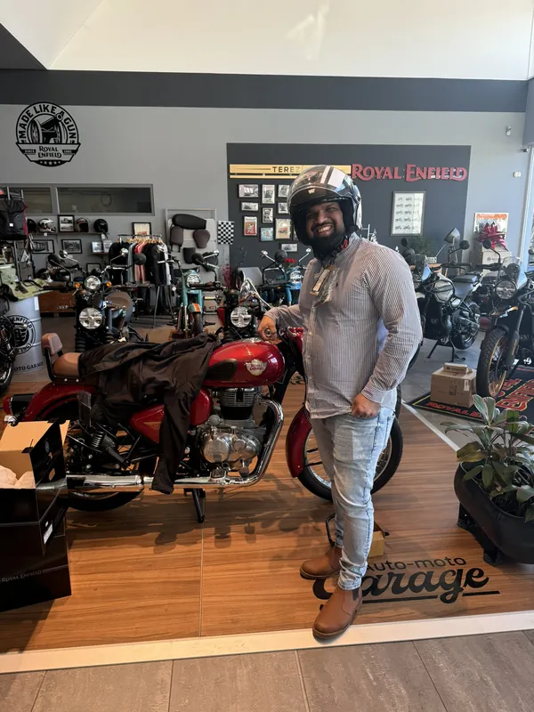 GARAGE customer at the handover of a new Royal Enfield motorcycle