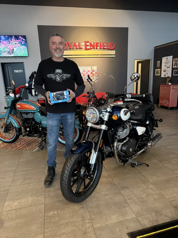 GARAGE customer at the handover of a new Royal Enfield motorcycle