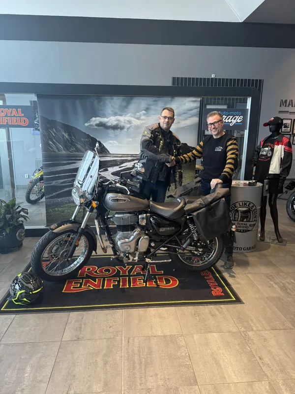 GARAGE customer at the handover of a new Royal Enfield motorcycle