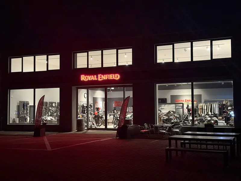 Illuminated Royal Enfield GARAGE showroom in the evening