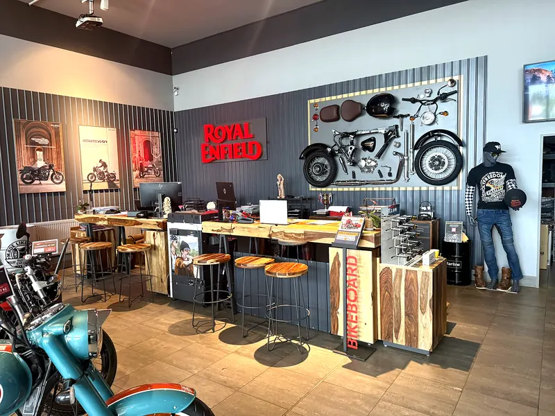 Counter with bar stools and Royal Enfield logo