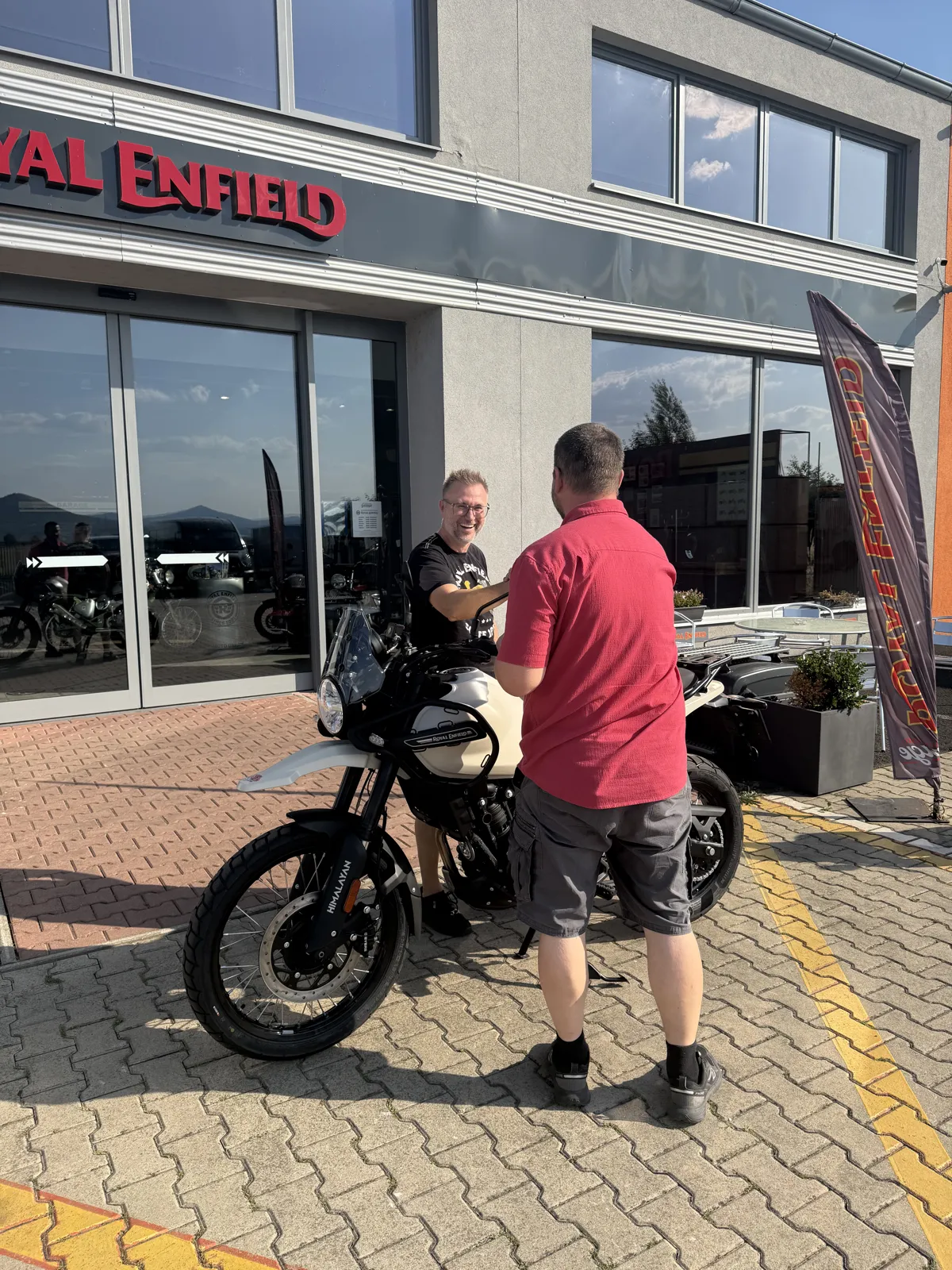GARAGE customer at the handover of a new Royal Enfield motorcycle