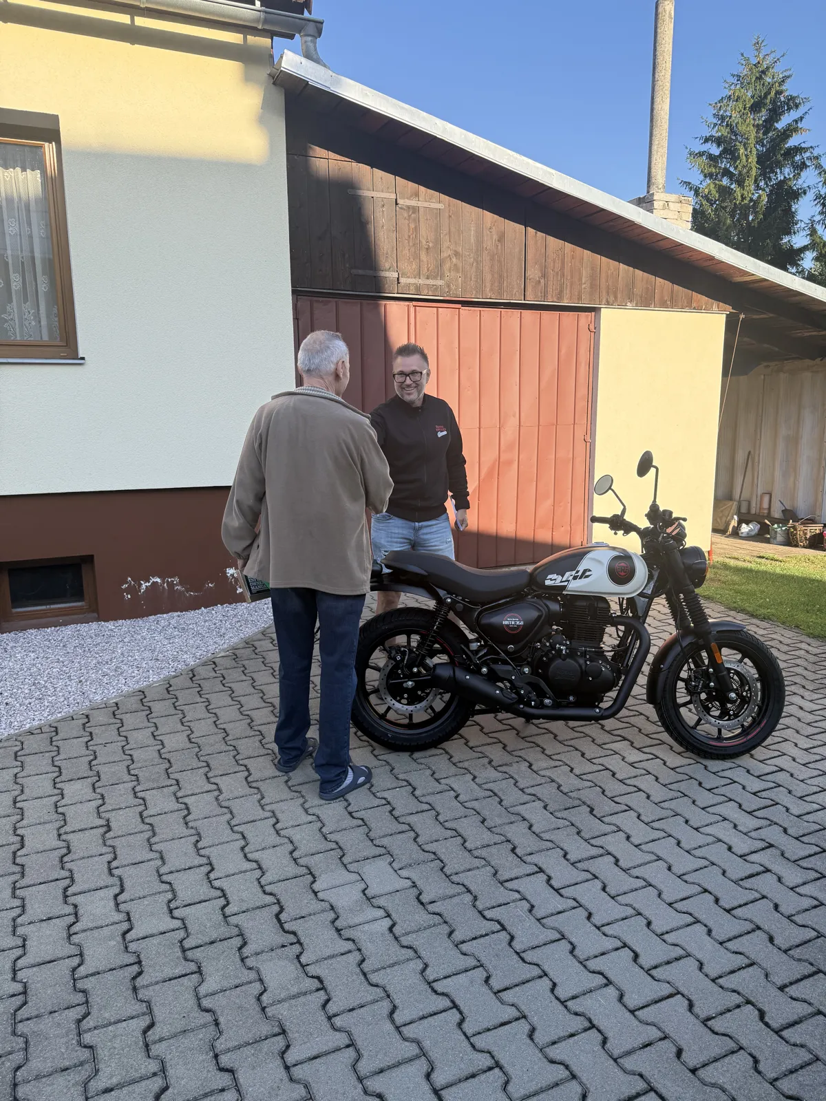 GARAGE customer at the handover of a new Royal Enfield motorcycle